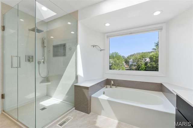 15747 Cedarmill Dr, Chesterfield, MO 63017 - bathroom featuring a bath, a stall shower, recessed lighting, a skylight, and vanity