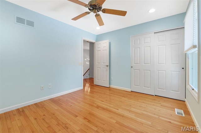 15747 Cedarmill Dr, Chesterfield, MO 63017 - unfurnished bedroom with light wood-type flooring, a closet, recessed lighting, a ceiling fan, and multiple windows