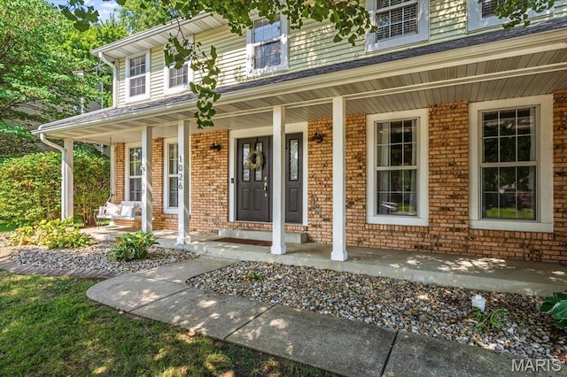1026 Timber Creek Ln, Ofallon, IL 62269 - view of exterior entry with a porch and brick siding