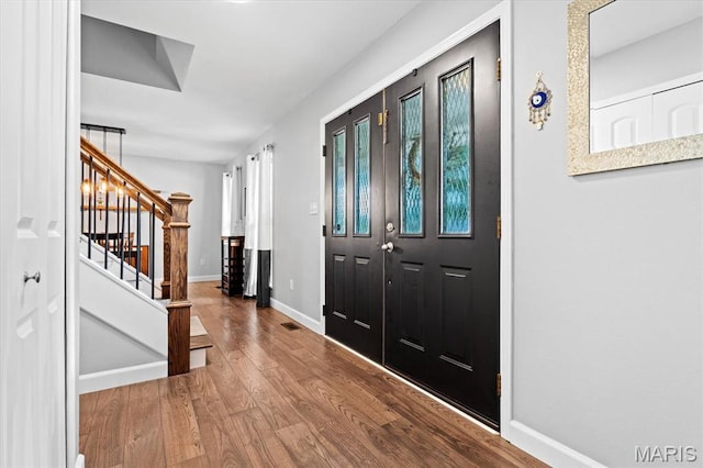 1026 Timber Creek Ln, Ofallon, IL 62269 - foyer entrance featuring wood finished floors and stairway