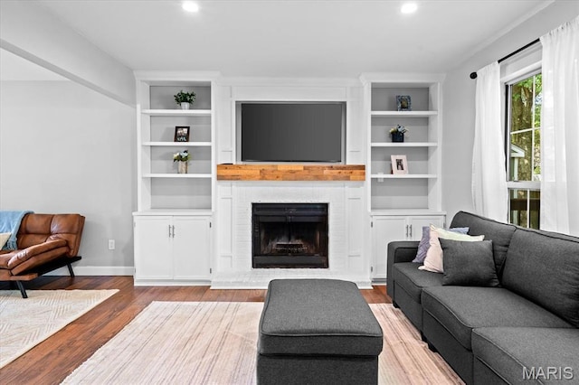 1026 Timber Creek Ln, Ofallon, IL 62269 - living room with wood finished floors, recessed lighting, a fireplace, and built in features
