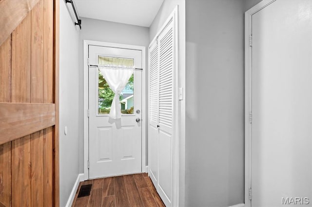 1026 Timber Creek Ln, Ofallon, IL 62269 - doorway featuring dark wood-style flooring and a barn door