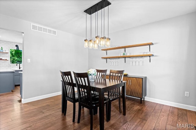 1026 Timber Creek Ln, Ofallon, IL 62269 - dining room with dark wood-style flooring and baseboards