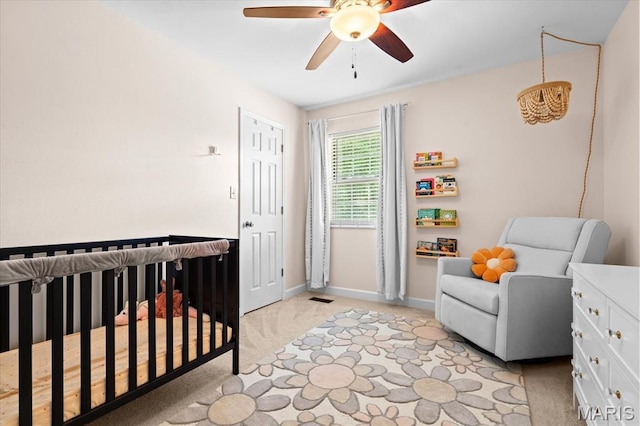 1026 Timber Creek Ln, Ofallon, IL 62269 - bedroom featuring light carpet, a crib, and ceiling fan