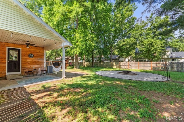 1026 Timber Creek Ln, Ofallon, IL 62269 - fenced backyard featuring a ceiling fan and a patio