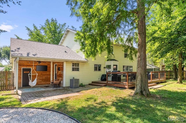 1026 Timber Creek Ln, Ofallon, IL 62269 - rear view of house featuring a deck, roof with shingles, and a patio area