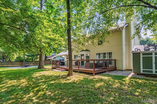 1026 Timber Creek Ln, Ofallon, IL 62269 - rear view of house featuring a chimney, a deck, and a shed