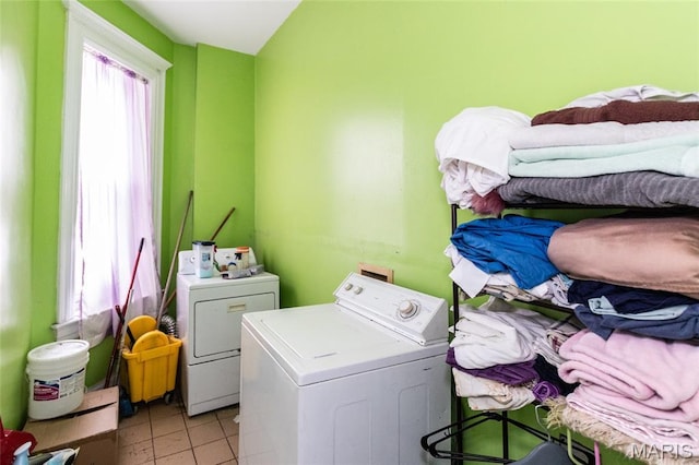 3815 N 20th St, Saint Louis, MO 63107 - washroom with washing machine and clothes dryer and light tile patterned floors