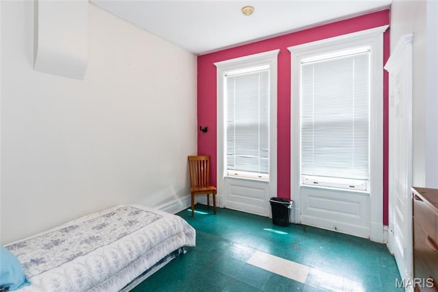 3815 N 20th St, Saint Louis, MO 63107 - bedroom with tile patterned floors and baseboards