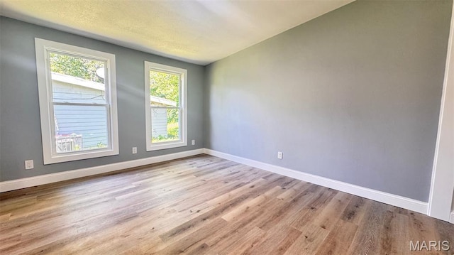 6822 Friarwood Dr, Saint Louis, MO 63134 - spare room with wood finished floors