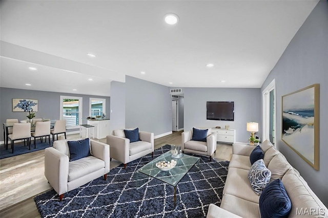 6822 Friarwood Dr, Saint Louis, MO 63134 - living room with wood finished floors and recessed lighting