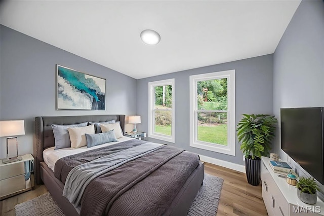 6822 Friarwood Dr, Saint Louis, MO 63134 - bedroom with light wood-style floors and baseboards