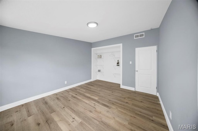 6822 Friarwood Dr, Saint Louis, MO 63134 - unfurnished bedroom with wood finished floors