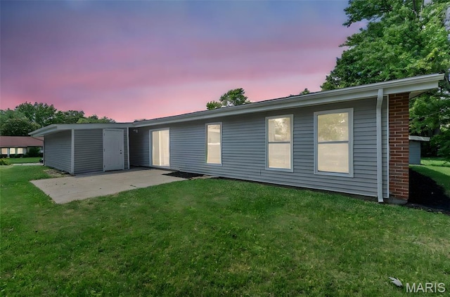 6822 Friarwood Dr, Saint Louis, MO 63134 - back of house featuring a patio and a lawn