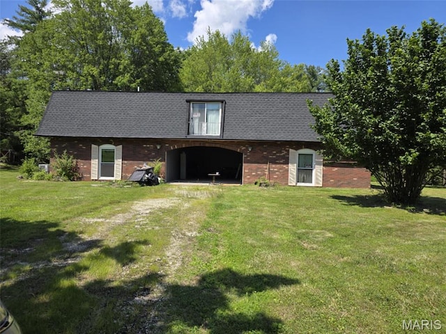478 Batchtown Rd, Batchtown, IL 62006 - rear view of house with brick siding, dirt driveway, and a yard