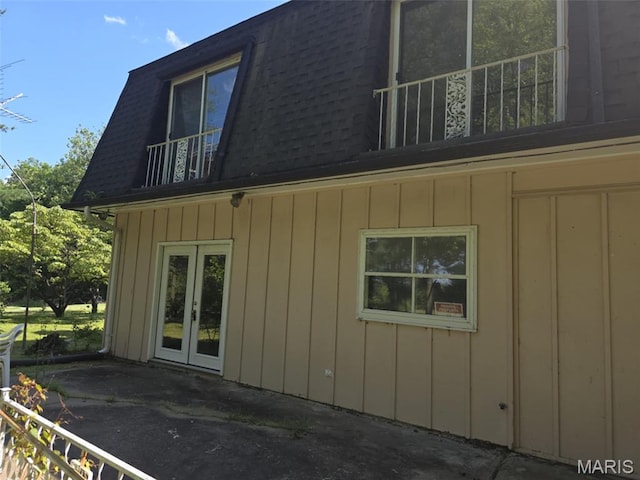 478 Batchtown Rd, Batchtown, IL 62006 - view of side of property featuring a balcony, mansard roof, a patio area, french doors, and a shingled roof