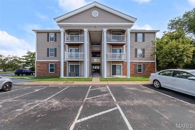 12114 Natural Bridge Rd Unit F, Bridgeton, MO 63044 - view of building exterior with uncovered parking