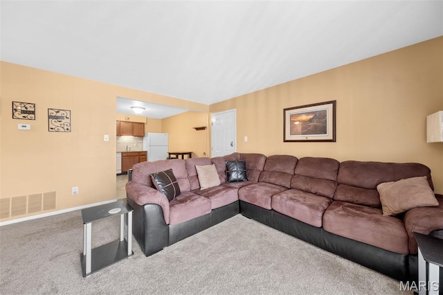 12114 Natural Bridge Rd Unit F, Bridgeton, MO 63044 - living room with carpet flooring and baseboards