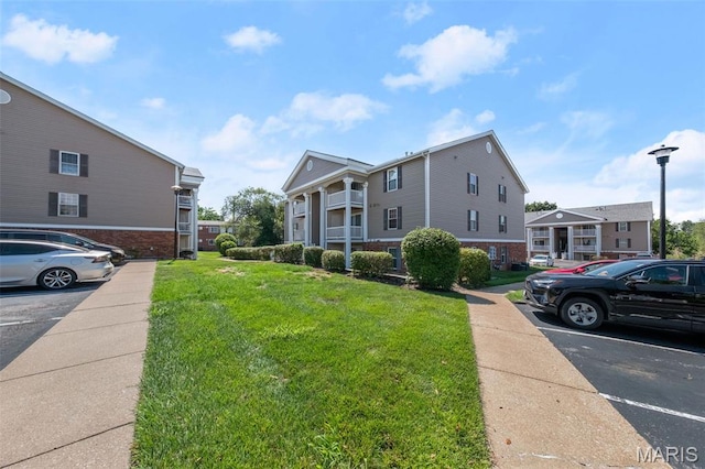 12114 Natural Bridge Rd Unit F, Bridgeton, MO 63044 - view of property with uncovered parking
