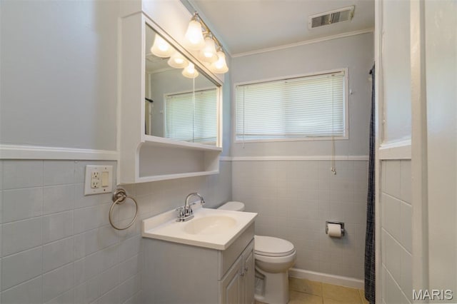 33 Southbrook Dr, Rolla, MO 65401 - bathroom with tile walls, vanity, tile patterned flooring, wainscoting, and crown molding