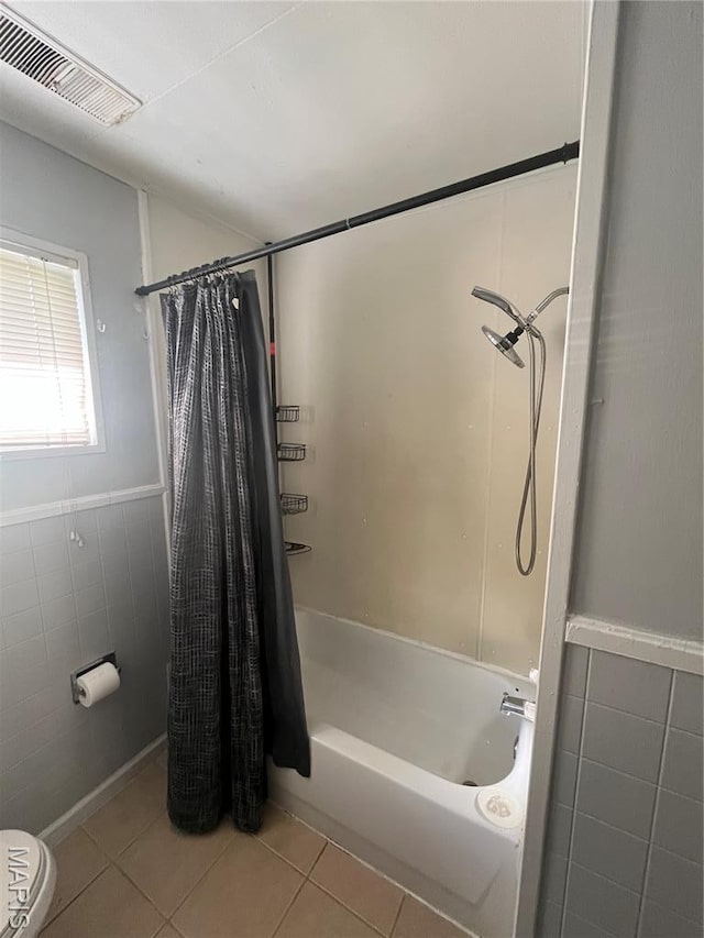 33 Southbrook Dr, Rolla, MO 65401 - full bathroom with tile walls, tile patterned flooring, shower / bath combination with curtain, and wainscoting