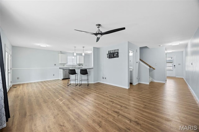 3112 Bentwater Pl, Saint Charles, MO 63301 - unfurnished living room with a ceiling fan, light wood-type flooring, and stairway