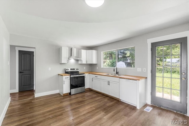 200 Francisca Dr, Florissant, MO 63031 - kitchen featuring stainless steel electric stove, white dishwasher, wall chimney range hood, wood counters, and dark wood-style floors
