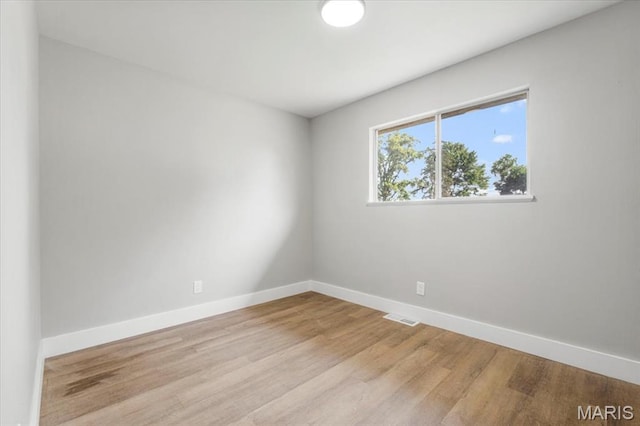 200 Francisca Dr, Florissant, MO 63031 - spare room featuring baseboards and wood finished floors