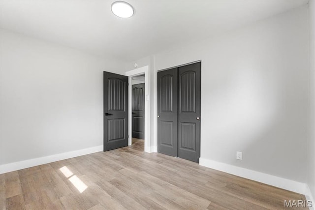 200 Francisca Dr, Florissant, MO 63031 - spare room featuring light wood-style flooring and baseboards