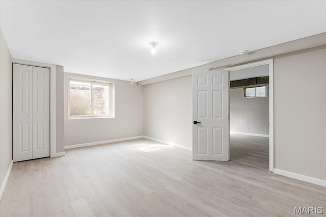 200 Francisca Dr, Florissant, MO 63031 - unfurnished bedroom featuring wood finished floors and multiple windows