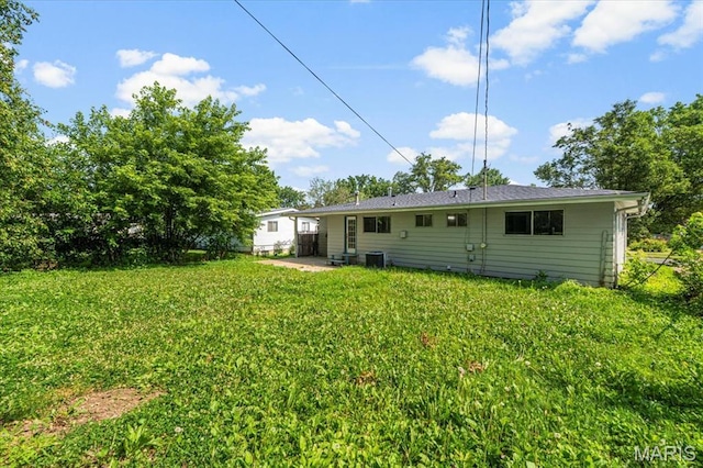 200 Francisca Dr, Florissant, MO 63031 - rear view of property with a lawn and a patio