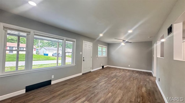 6613 Dunwold Dr, Saint Louis, MO 63134 - entryway with dark wood finished floors and ceiling fan