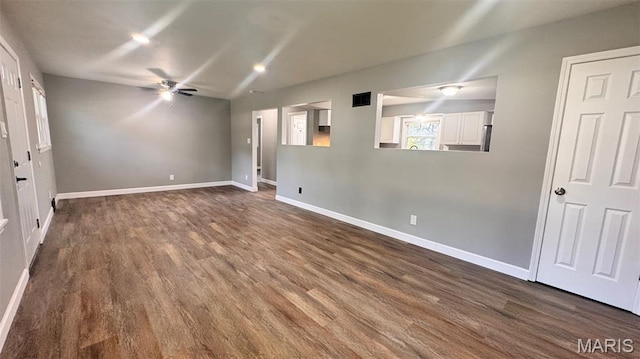 6613 Dunwold Dr, Saint Louis, MO 63134 - unfurnished room featuring dark wood-type flooring and a ceiling fan