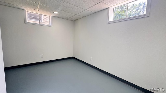 6613 Dunwold Dr, Saint Louis, MO 63134 - below grade area with a paneled ceiling and baseboards