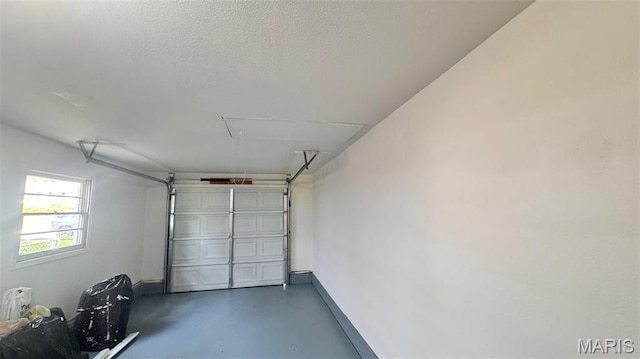 6613 Dunwold Dr, Saint Louis, MO 63134 - garage with baseboards