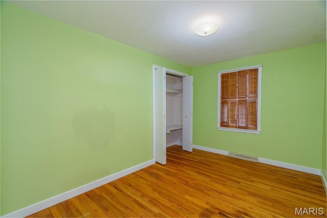 517 E 2nd St, Rolla, MO 65401 - unfurnished bedroom with wood finished floors and a closet