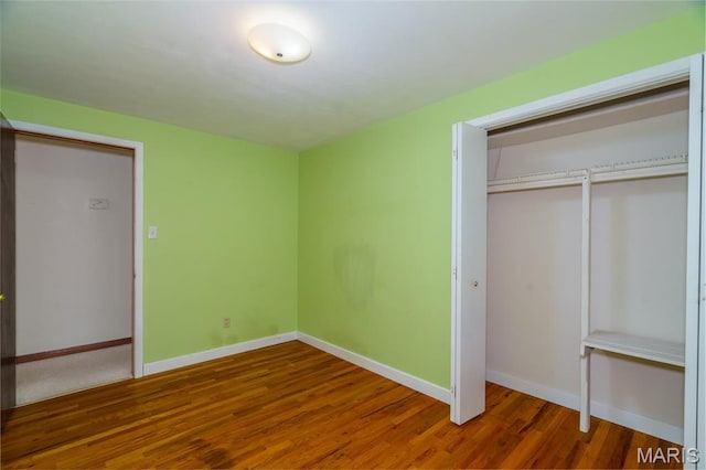 517 E 2nd St, Rolla, MO 65401 - unfurnished bedroom featuring wood finished floors and a closet
