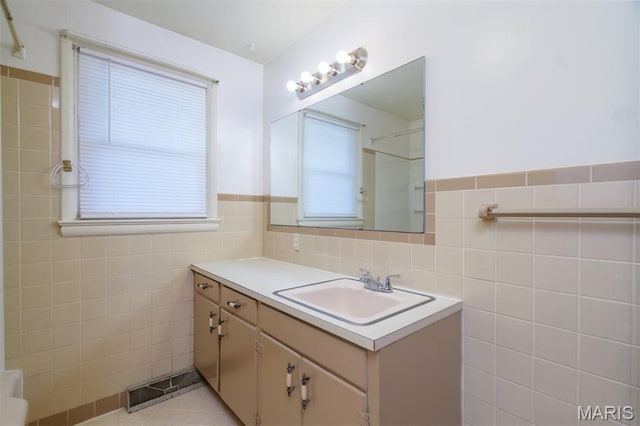 517 E 2nd St, Rolla, MO 65401 - full bathroom with tile walls, vanity, a shower, and wainscoting