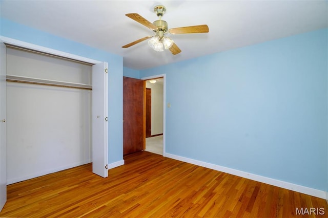 517 E 2nd St, Rolla, MO 65401 - unfurnished bedroom featuring a closet, wood finished floors, and ceiling fan