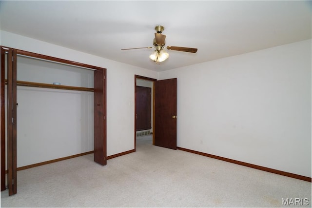 517 E 2nd St, Rolla, MO 65401 - unfurnished bedroom featuring light carpet, a closet, and a ceiling fan