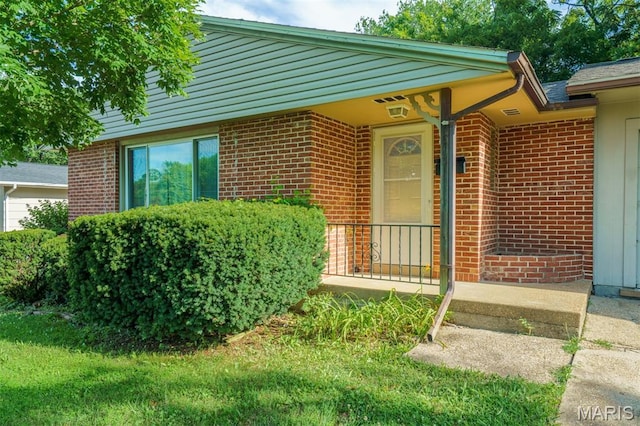 517 E 2nd St, Rolla, MO 65401 - property entrance with brick siding