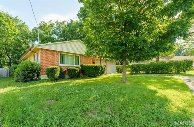 517 E 2nd St, Rolla, MO 65401 - view of side of home with brick siding and an attached garage
