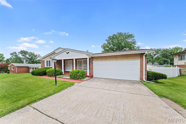 670 Gateswood Dr, Florissant, MO 63033 - ranch-style home with brick siding, concrete driveway, an attached garage, and covered porch