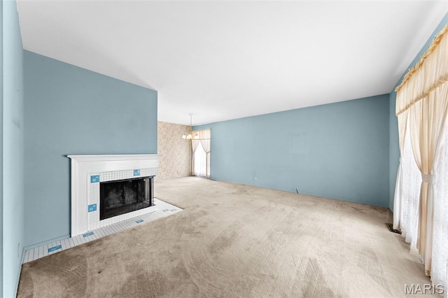 670 Gateswood Dr, Florissant, MO 63033 - unfurnished living room with carpet flooring and a tile fireplace