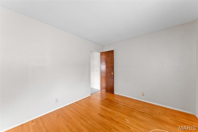 670 Gateswood Dr, Florissant, MO 63033 - spare room with wood finished floors and baseboards