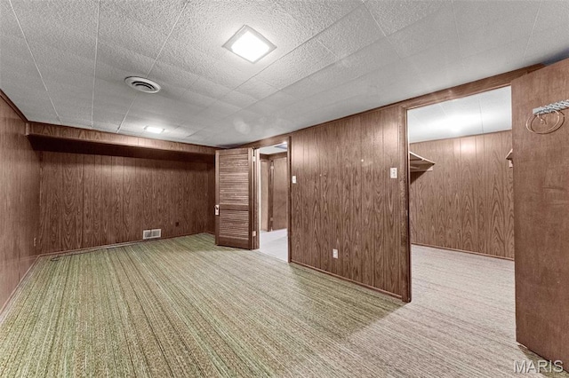 670 Gateswood Dr, Florissant, MO 63033 - finished basement with wooden walls and carpet flooring
