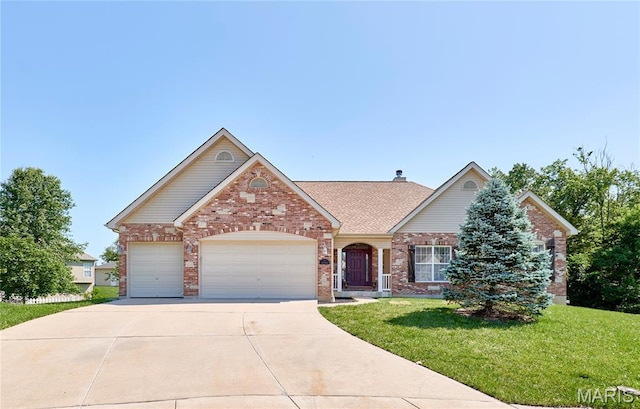 5 Tucker Manor Ct, Wentzville, MO 63385 - view of front of house with brick siding, a front yard, a garage, concrete driveway, and a shingled roof