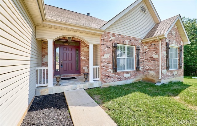 5 Tucker Manor Ct, Wentzville, MO 63385 - entrance to property featuring brick siding, roof with shingles, and a lawn