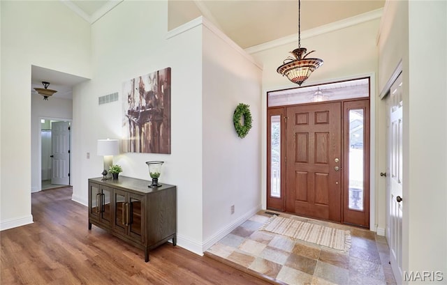 5 Tucker Manor Ct, Wentzville, MO 63385 - entrance foyer with a towering ceiling, crown molding, plenty of natural light, and a chandelier