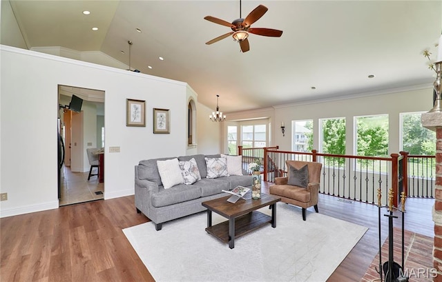 5 Tucker Manor Ct, Wentzville, MO 63385 - living room with a ceiling fan, wood finished floors, a chandelier, lofted ceiling, and crown molding